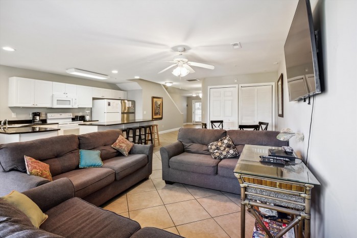Open living area and kitchen inside a condo at Ambassador Villas