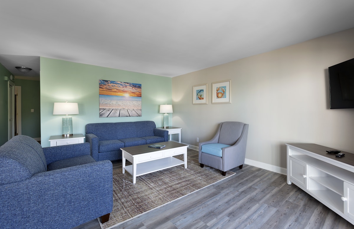 Living area of a Chelsea condo at Caribbean Resort and Villas, with sofas and a coffee table