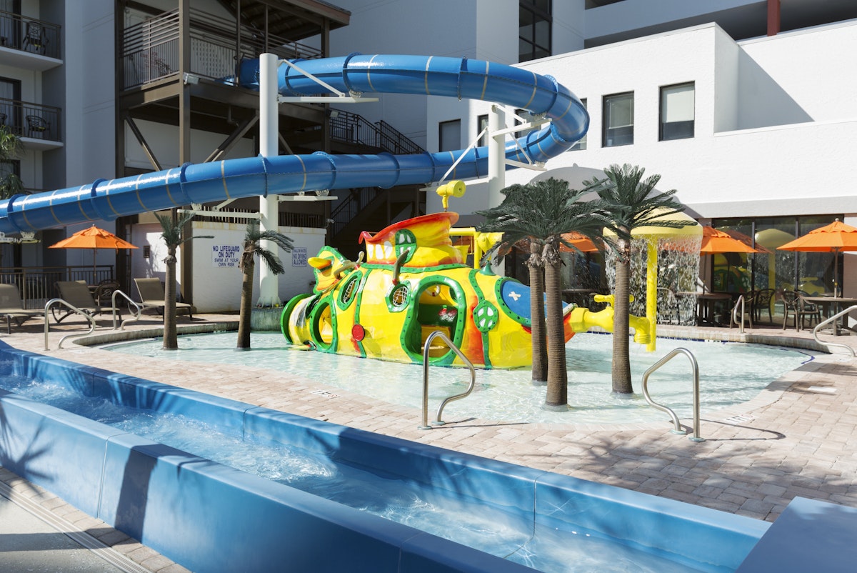 The waterslide and the Silly Submarine kids pool at Grande Cayman Resort