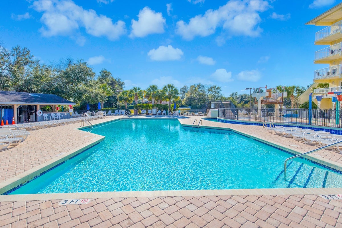 The outdoor pool and sun loungers beside the Summerhouse at Litchfield Beach and Golf Resort