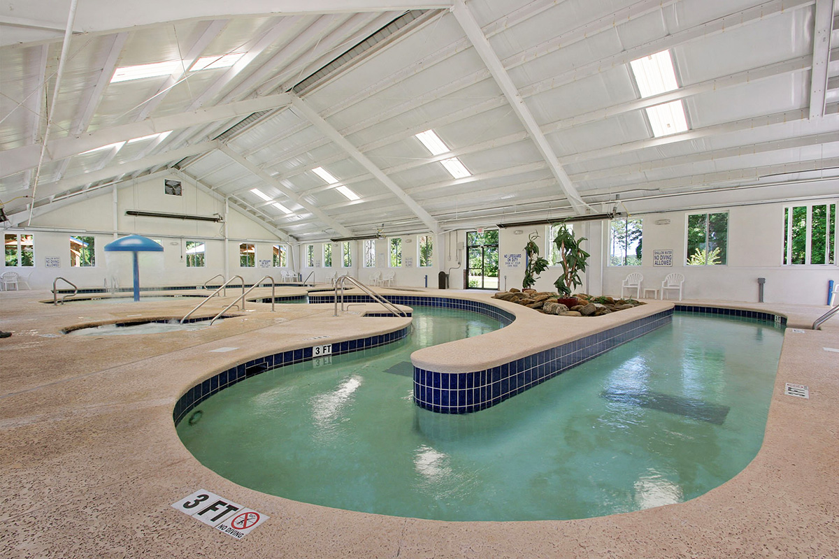 The indoor lazy river and hot tub in the amenity center at Myrtlewood