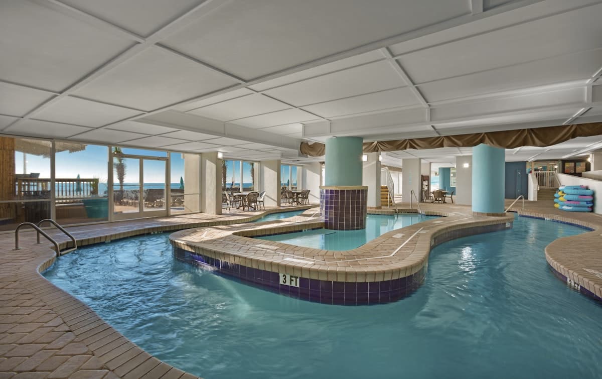 The indoor lazy river looking out to the ocean at Paradise Resort