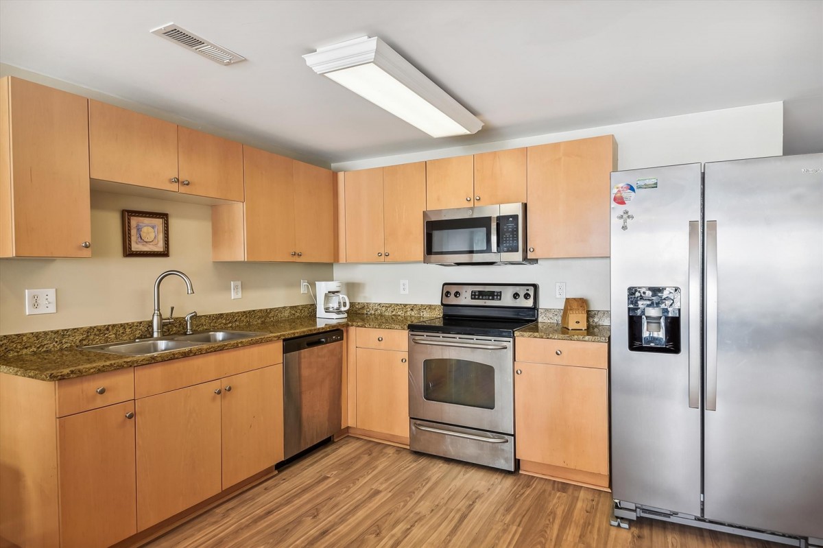 Villa kitchen at Pier Watch with granite counters and full size appliances