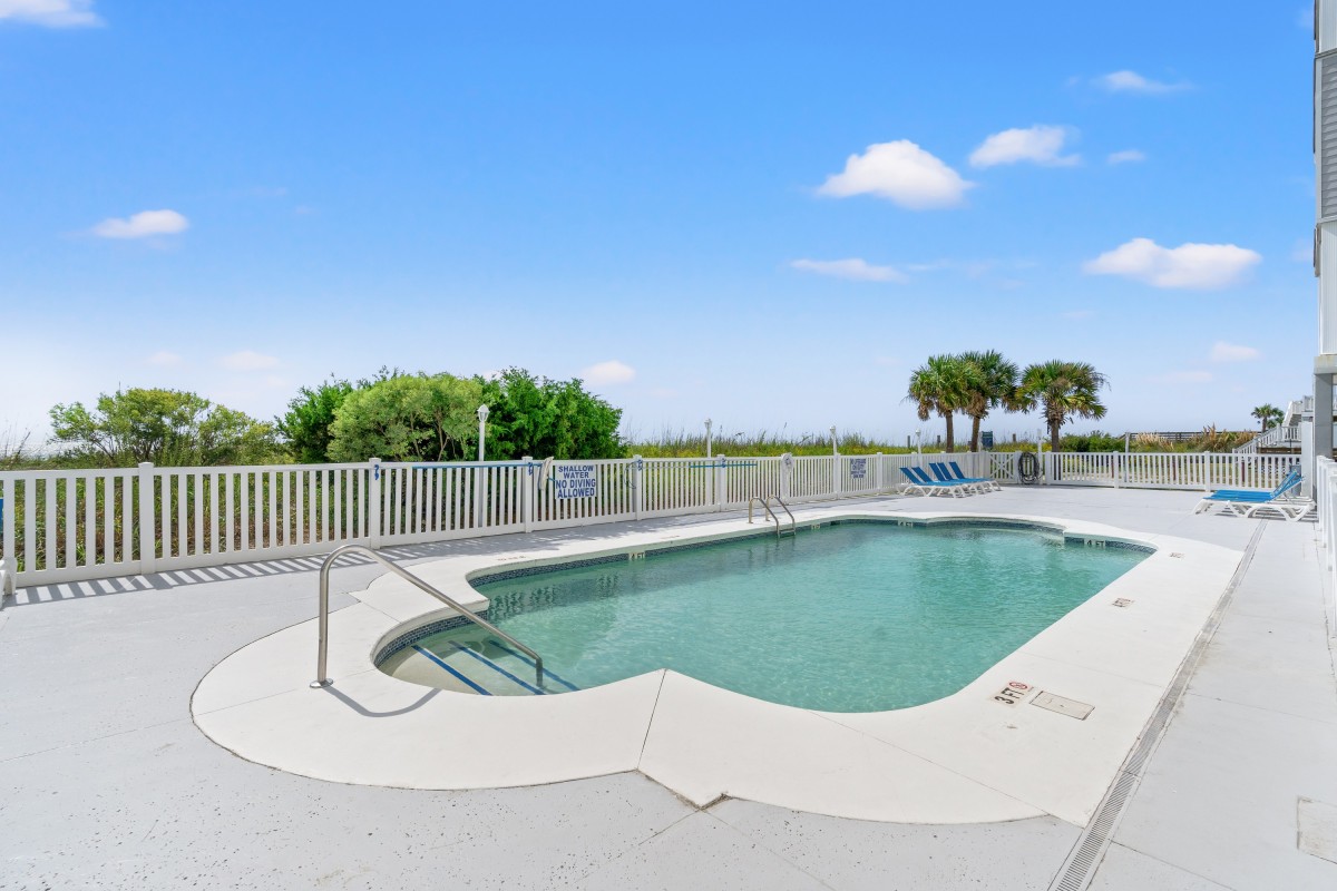 The outdoor pool beside the dunes at Pier Watch Villas