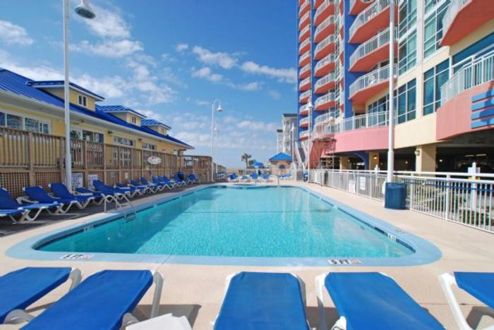 The outdoor pool and sun loungers on the deck at the Prince Resort