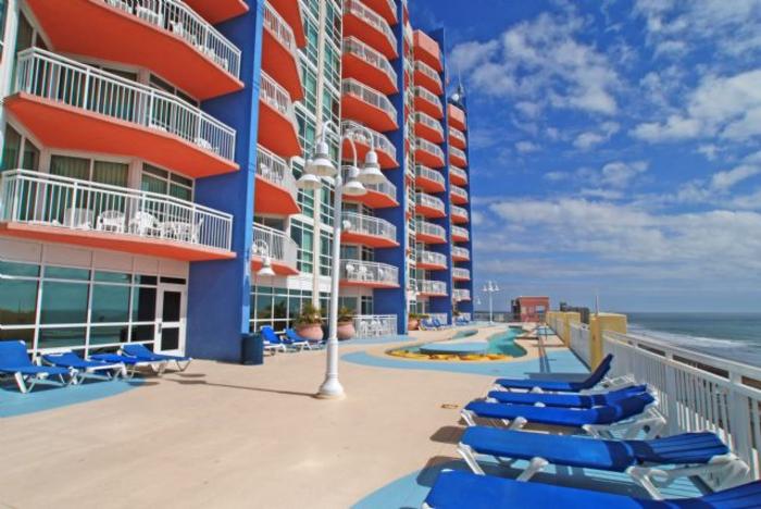 The oceanfront deck and lazy river running beside the tower at the Prince Resort