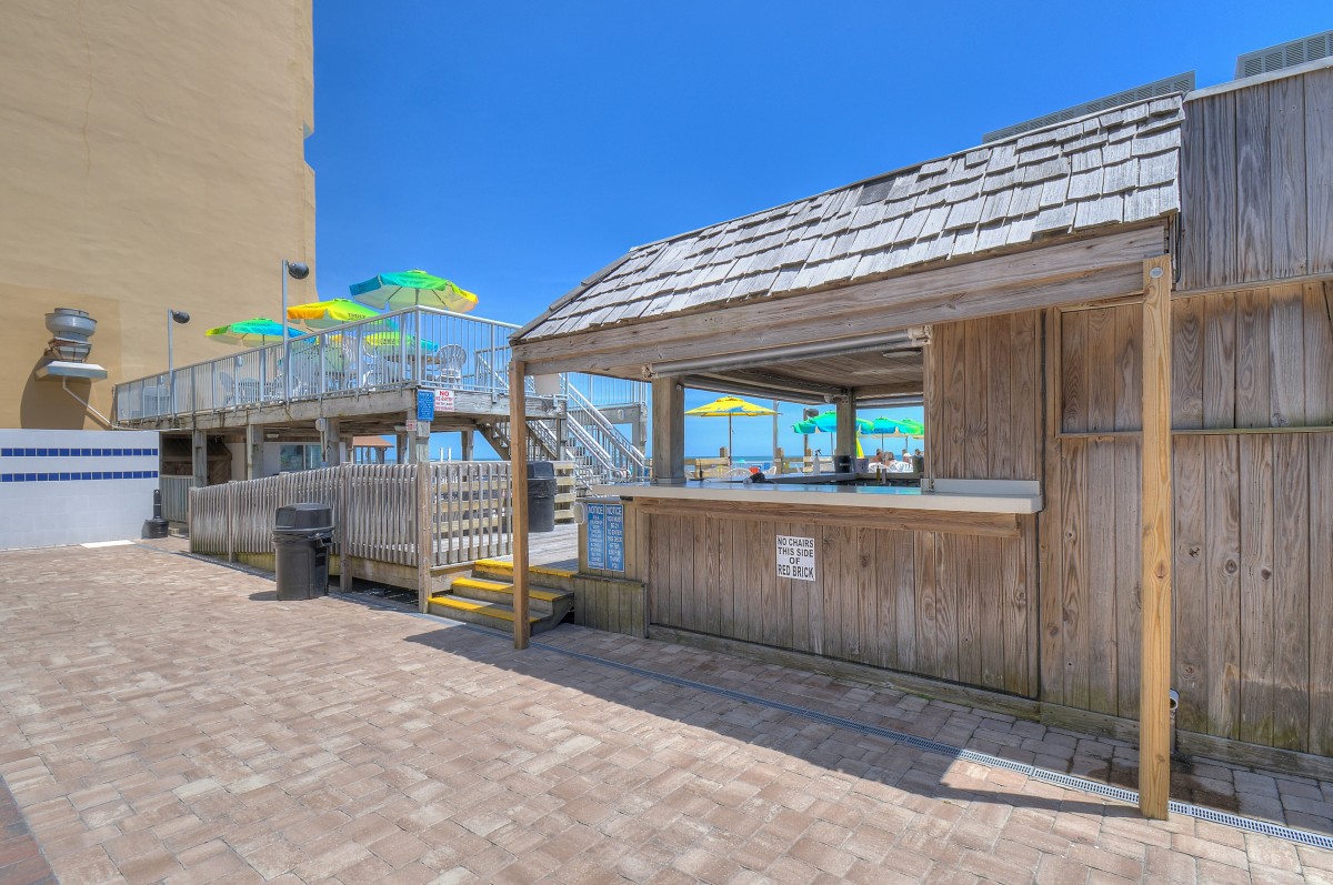 The oceanfront bar and shaded deck at Sands Ocean Club